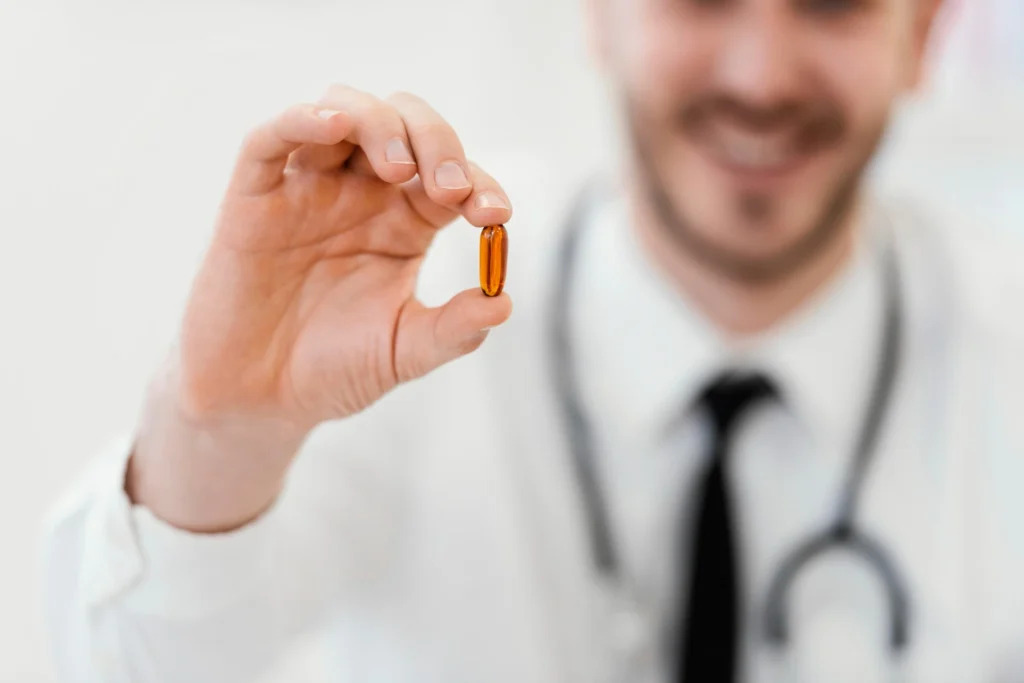 The medic shows a capsule containing tesofensin