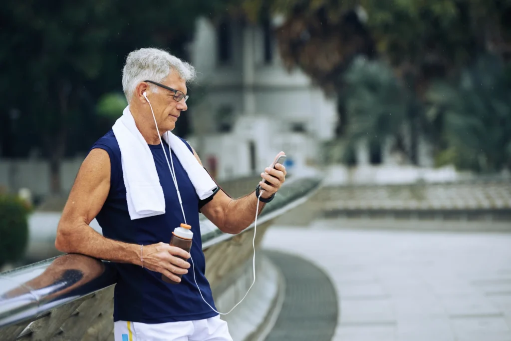 old man looking at phone